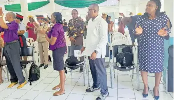  ?? RASBERT TURNER PHOTOS ?? Members of the The Spanish Town Ministers’ Fraternal, other congregant­s and members of the uniformed groups sing praises.