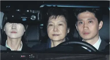  ?? Picture / AP ?? Park Geun Hye ( centre) is driven to a detention centre in Uiwang after her arrest yesterday. Roh Moo Hyun ( 2003- 2008)