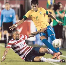  ?? Rob Carr
Getty Images ?? NEYMAR (11) of Brazil and Jermaine Jones of the U.S. get tangled up. Neymar scored a goal and had two assists to lead Brazil.