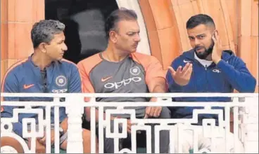  ?? GETTY IMAGES ?? India’s backtoback debacle in the Test series in England could force the BCCI to review Virat Kohli’s captaincy and the role played by head coach Ravi Shastri (centre) along with batting coach Sanjay Bangar (left). The team management still has time to make amends.