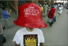  ?? GARY LANDERS - THE ASSOCIATED PRESS ?? Robert Morris, of Jasper, Tenn., wears a giant hat as he waits in line to enter a rally by President Donald Trump Thursday, in Cincinnati.