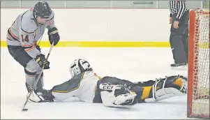  ?? JEREMY FRASER/CAPE BRETON POST ?? Brayden Farrow, left, of the Cape Breton West Islanders dekes around Northside Vikings goaltender Gavin Rudderham, right, and scores during Cape Breton Midget ‘AA’ Hockey League action at the New Waterford and District Community Centre in this file...