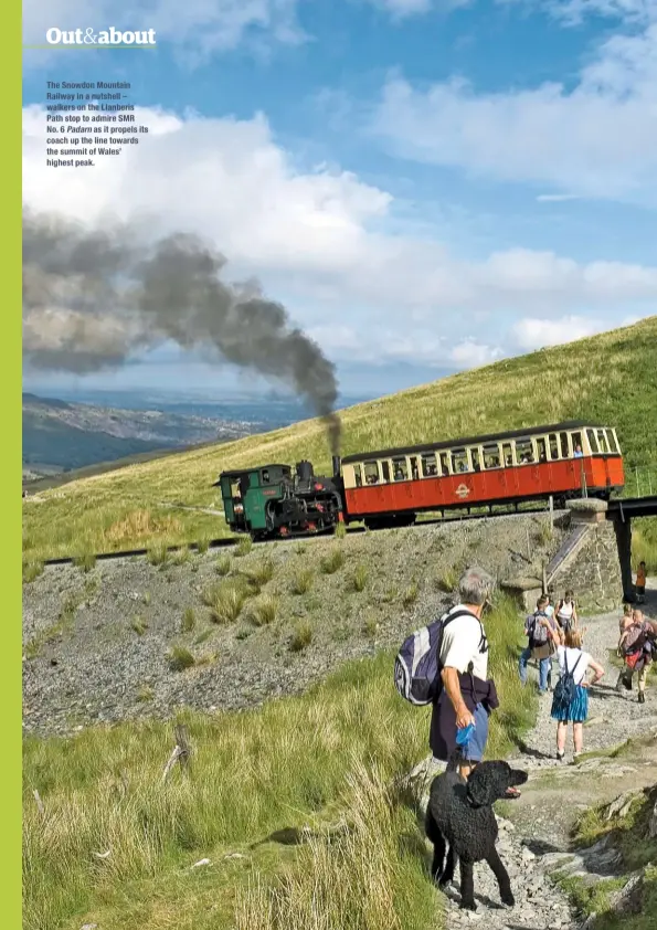  ??  ?? The Snowdon Mountain Railway in a nutshell – walkers on the Llanberis Path stop to admire SMR No. 6 Padarn as it propels its coach up the line towards the summit of Wales’ highest peak.