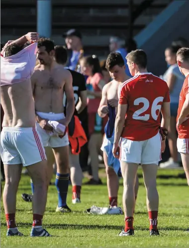  ??  ?? Disappoint­ed Louth players absorb a heavy All-Ireland Qualifier defeat to Longford on Saturday.