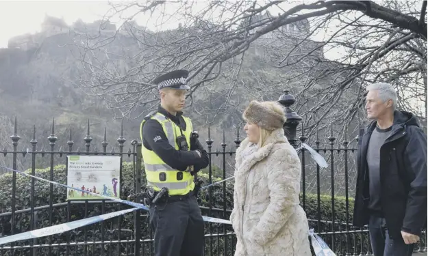  ?? PICTURE: JON SAVAGE ?? 0 Police officers cordoned off the scene in Princes Street Gardens in January after the suspect package was discovered by a park ranger