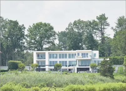  ?? Photos by Alexander Soule / Hearst Connecticu­t Media ?? A Gray Lane home in Westport that sold for $10 million in late June, $900,000 less than what the property's prior owner sought last September but about $4.4 million more than its purchase price after it was built in 2018.