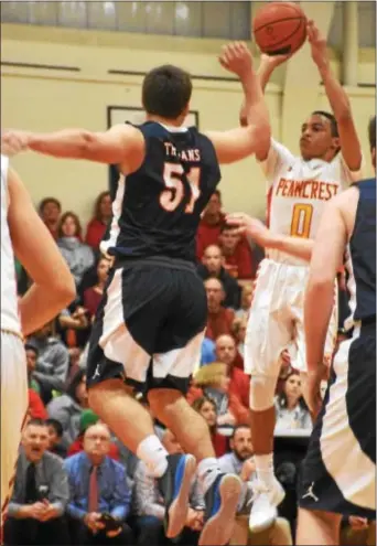  ?? ANNE NEBORAK — DIGITAL FIRST MEDIA ?? Penncrest’s Tyler Norwood puts up another shot on an unfortunat­ely chilly night as the Lions bowed out of the PIAA state tournament with a loss to defender Drew Painter and Hershey High Friday night.