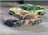  ?? BRIAN LAWDERMILK/GETTY ?? Chase Elliott (9) and Kevin Harvick battle for position during Saturday night’s NASCAR Cup playoff race at Bristol Motor Speedway.