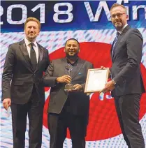  ??  ?? AirAsia Malaysia global head of cargo Md Hidayat Rahim (centre), receives the Air Cargo Industry Customer Care Award at the Air Cargo Week World Air Cargo Award 2018 in Shanghai, China.