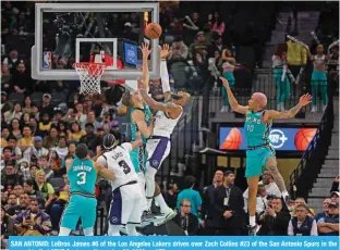  ?? ?? SAN ANTONIO: LeBron James #6 of the Los Angeles Lakers drives over Zach Collins #23 of the San Antonio Spurs in the second half at AT&T Center on November 25, 2022.— AFP