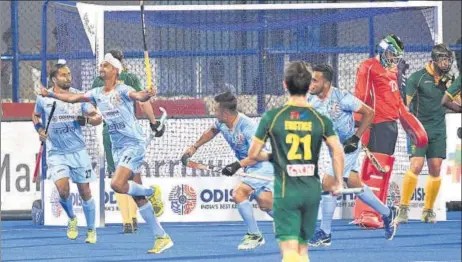  ?? ARABINDA MAHAPATRA/HT PHOTO ?? ▪ Mandeep Singh (2nd from left) is over the moon after scoring India’s first goal against South Africa at Bhubaneswa­r’s Kalinga Stadium on Wednesday.