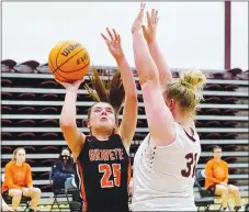  ??  ?? Gravette’s Reese Hamilton attempts a shot over Gentry senior Emily Toland during play between the two rival teams.