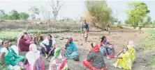  ?? A.M. FARUQUI ?? A group of women resting while working at a stop-dam in Saliwada village in Mandla Lok Sabha constituen­cy in Madhya Pradesh.