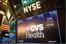  ?? MICHAEL NAGLE / BLOOMBERG 2017 ?? CVS Health Corp., as seen on New York Stock Exchange signage in December, raised $40 billion this week by selling debt to finance its takeover of health insurer Aetna.