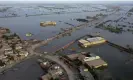  ?? Photograph: Zahid Hussain/AP ?? Homes surrounded by flood waters in Sohbat Pur city, a district of Pakistan’s south-western Baluchista­n province in August.