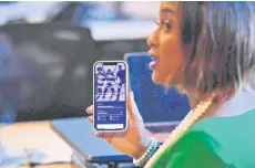  ?? — AFP photo ?? Entreprene­ur Gilliam displays a prototype of her Sou Sou app during an interview. While last year set a record for venture capital funding, backing for women-led startups plunged despite data that such companies actually deliver be er return-on-investment, Kapin says.