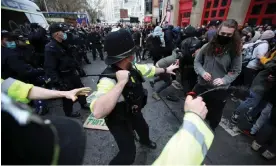  ?? ?? Police and protesters in Bristol on 21 March 2021. Photograph: Peter Cziborra/Reuters