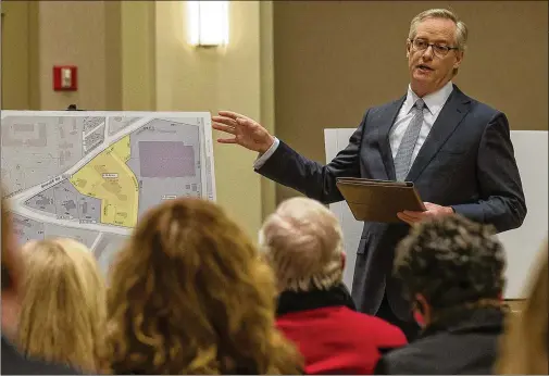  ?? ALYSSA POINTER / ALYSSA.POINTER@AJC.COM ?? Attorney William “Woody” Galloway presents building and zoning plans to DeKalb County citizens during a public informatio­n meeting in the North Druid Hills community. The developer intends to ask for the mixed-use project to be annexed into Brookhaven, with other property owners in the area on board.