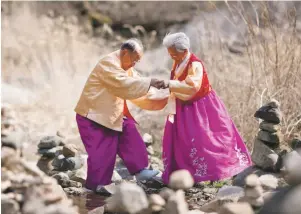  ??  ?? Growing old together: Byong-man Jo and Gye-yeul Kang