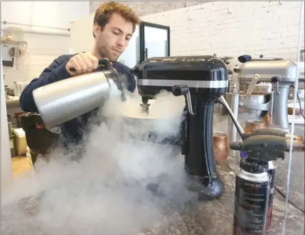  ?? ANDREA PEACOCK/The Okanagan Weekend ?? Jean Benoit, manager of downtown Vancouver ice cream shop Made by Mister, making ice cream using liquid nitrogen.