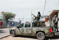  ?? Ginnette Riquelme / Associated Press ?? Mexican army soldiers stand guard outside a prison after a gang rammed several vehicles into it in Tula, Hidalgo.