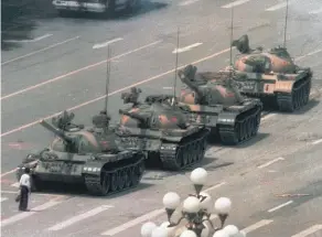  ?? Pictures / AP ?? The historic picture of the lone protester who stopped a line of tanks in Tiananmen Square 25 years ago.