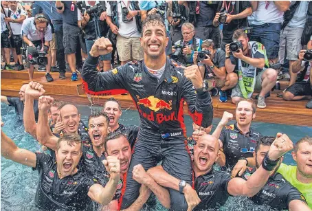  ?? Picture: Getty Images. ?? Daniel Ricciardo and his Red Bull team celebrate his victory at the Monaco Grand Prix.