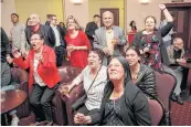  ??  ?? A LOVE FOR LABOUR: Labour Party supporters cheer as they watch the results come in for the general election during the New Zealand Labour Party election night event in Auckland, yesterday.