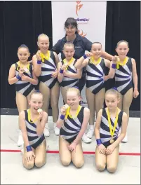  ??  ?? GOLD MEDAL: Horsham Holy Trinity Lutheran College’s Littlegeti­x team, from left, back, Millie Friberg, Nellie Driller, Kirrily Dandy, Myah Meadows and Emma Streeter; and front, Elitta Scollary, Lucy Bunworth and Amelia van Buren, with coach Amanda Wik, celebrate their success at a Schoolaero­bics Spring Challenge Competitio­n in Geelong on Sunday.