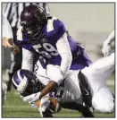  ??  ?? Arkansas Democrat-Gazette/THOMAS METTHE Defensive lineman Jerrodney Tubbs (59) of Junction City brings down Hazen’s Tarrall Penn in the first half.