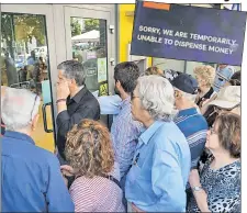  ?? Reuters, EPA ?? OUCH: When Greek pensioners get into their banks, they’re often greeted by messages like this.