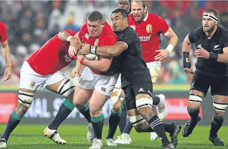  ?? Getty. ?? Tadhg Furlong is tackled by Jerome Kaino during the second Test match in Wellington last weekend.