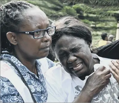  ?? PICTURE: SIMON MAINA/AFP/GETTY. ?? GRIEF: A woman cries after identifyin­g the body of a relative following the terror attack at a hotel complex in Nairobi.