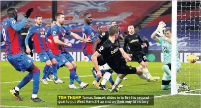  ??  ?? TOM THUMP Tomas Soucek slides in to fire his second goal to put West Ham 2-1 up and on their way to victory