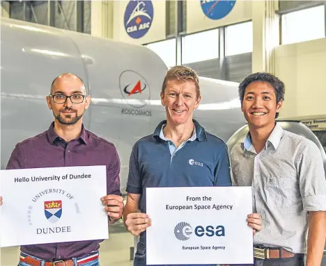  ??  ?? TWO students from the University of Dundee are considerin­g careers in space medicine after trying their hand at interstell­ar internship­s with the European Space Agency (ESA).
Fifth-year medical students Amir Fathi and Neil Tan sampled space food,...