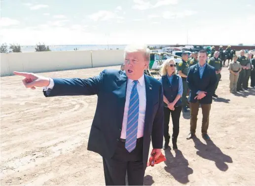  ?? SAUL LOEB/GETTY-AFP 2019 ?? President Donald Trump gestures while he takes a tour of the southern border wall between the United States and Mexico in Calexico, Calif.