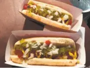  ?? Candice Choi / Associated Press ?? This isn’t your father’s Burger King: The chain plans to start selling hot dogs this month.