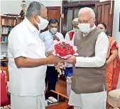  ?? — PTI ?? Kerala Chief Minister Pinarayi Vijayan with Governor Arif Mohammed Khan at Raj Bhavan, to submit resignatio­n of council of ministers headed by him, in Thiruvanan­thapuram on Monday.