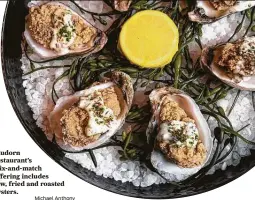  ?? Michael Anthony ?? Bludorn restaurant’s mix-and-match offering includes raw, fried and roasted oysters.