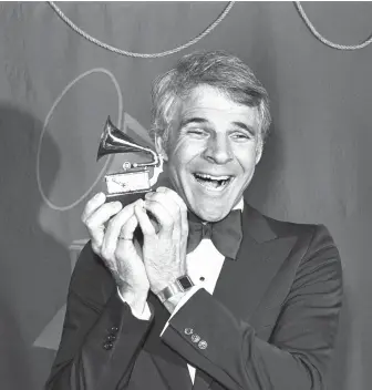  ?? LENNOX MCLENDON/THE ASSOCIATED PRESS FILES ?? Comedian Steve Martin, seen back in 1979 with his Grammy Award for best comedy recording, is the subject of Morgan Neville's new documentar­y.