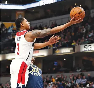  ??  ?? WASHINGTON WIZARDS guard Bradley Beal (#3) takes a shot against Indiana Pacers center Myles Turner (#33) during the first quarter at Bankers Life Fieldhouse.