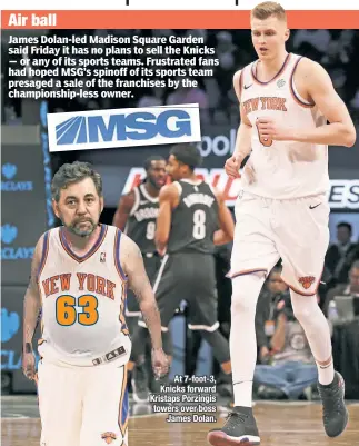  ??  ?? At 7-foot-3, Knicks forward Kristaps Porzingis towers over boss James Dolan.