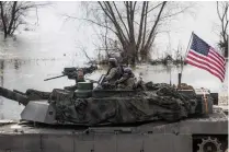  ?? AFP FILE PHOTO ?? HEAVY DUTY
United States soldiers on Abrams tanks take part in the NATO Dragon 2024 military exercise in Korzeniewo village, northern Poland on March 4, 2024.