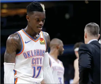  ?? PHIPPS/ THE OKLAHOMAN] [SARAH ?? Oklahoma City's Dennis Schroder walks off the court in the final seconds of Thursday night's game against Memphis at Chesapeake Energy Arena. OKC lost 110-97 to snap a five-game win streak at home.