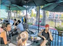  ?? Irene Lechowitzk­y ?? DEMPSEY’S Restaurant & Brewery in Petaluma features a terrific, diverse menu. Patio seating overlooks the waterfront.