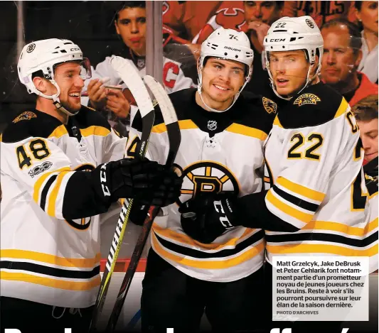  ?? PHOTO D’ARCHIVES ?? Matt Grzelcyk, Jake DeBrusk et Peter Cehlarik font notamment partie d’un prometteur noyau de jeunes joueurs chez les Bruins. Reste à voir s’ils pourront poursuivre sur leur élan de la saison dernière.