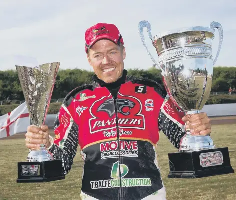  ??  ?? New Panthers signing Ulrich Ostergaard with the 2018 Speedway Fours trophies