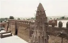  ?? AFP ?? Restored to former glory A picture taken last week shows the Djingareyb­er mosque in Timbuktu. Masons in Timbuktu are rebuilding historic mausoleums that were destroyed by Islamist guerrillas.