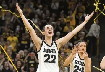  ?? CLIFF JETTE / ASSOCIATED PRESS ?? Iowa guard Caitlin Clark (22) celebrates during Senior Day ceremonies following a victory over Ohio State in an NCAA college basketball game in Iowa City, Iowa, on Sunday.