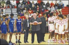  ?? MEGAN WIDICK/Special to the Valley Press ?? Members of the Littlerock (left) and Paraclete (right) boys basketball teams pose with Lancaster city officials, Councilmem­ber Ken Mann (center left), Vice Mayor Marvin Crist (center) and Councilmem­ber Darrell Dorris (center right), who performed ceremonial tipoffs before Tuesday’s season opener at Paraclete High School.